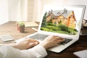 what is my house worth researching real estate info on a laptop